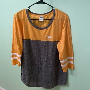 Mustered yellow/Grey shirt pink logo in the front and back of the shirt